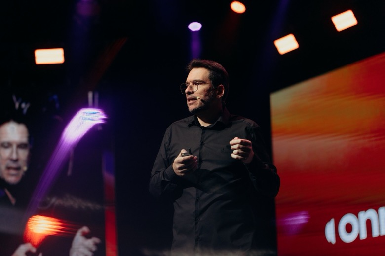 Fernando Palacios speaking, mid gesture