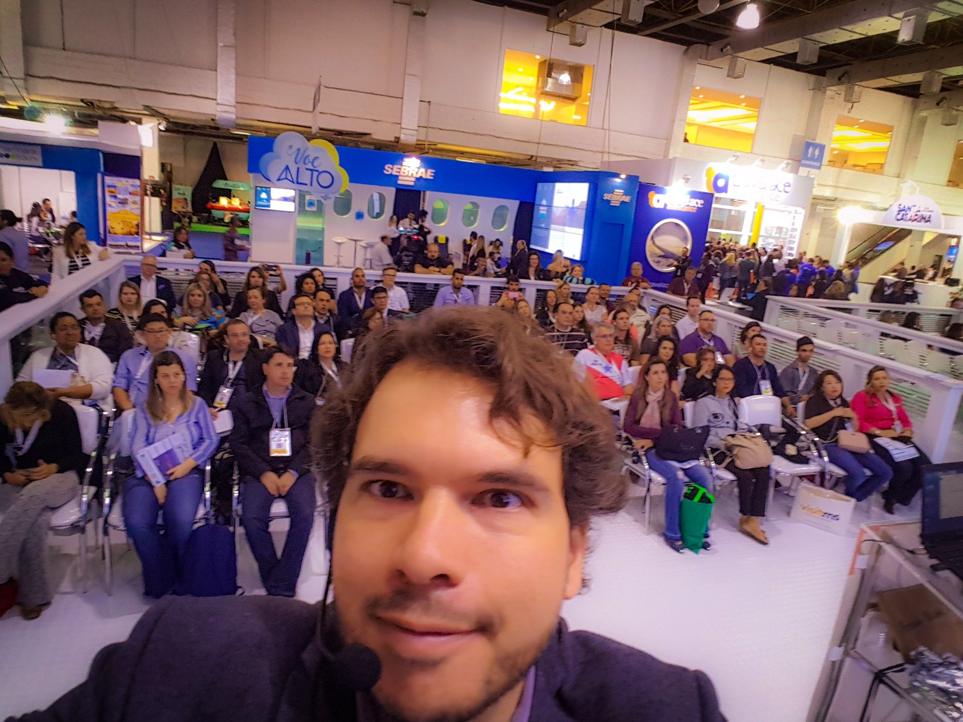 Fernando Palacios on stage during a presentation, seen from the audience